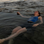 Fine art editorial fashion photography commission laying in river, Steve Giovinco