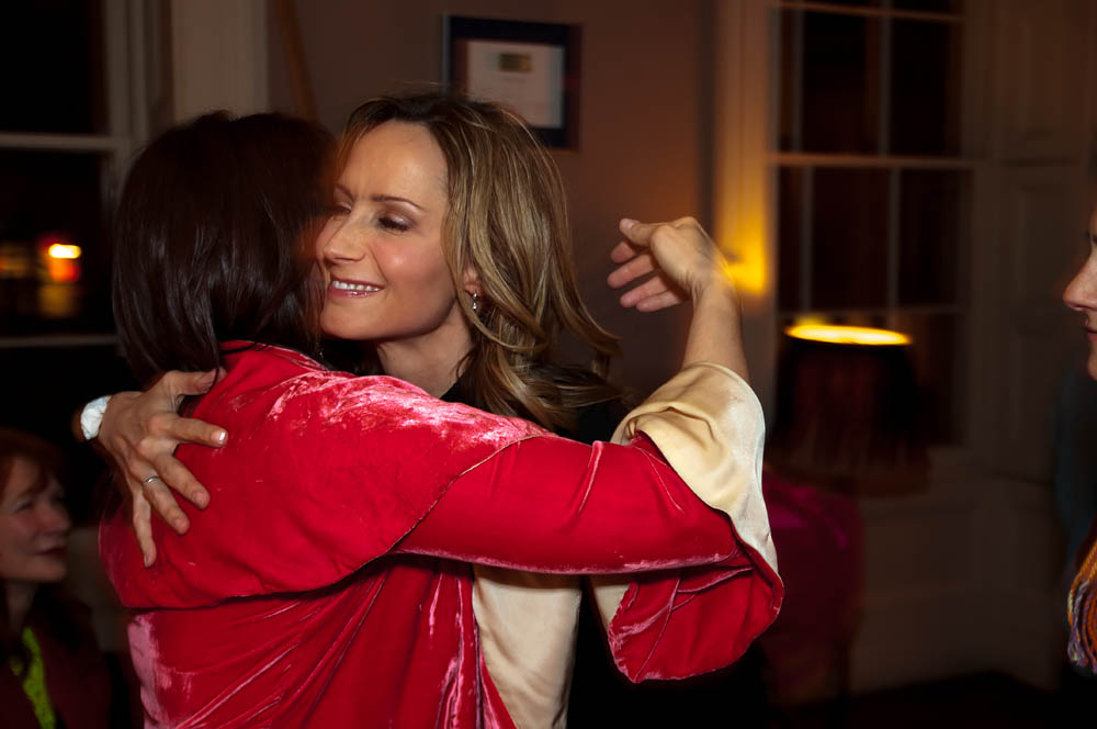 Fine art event documentary photography Rosanne Cash hugs in NYC, Steve Giovinco