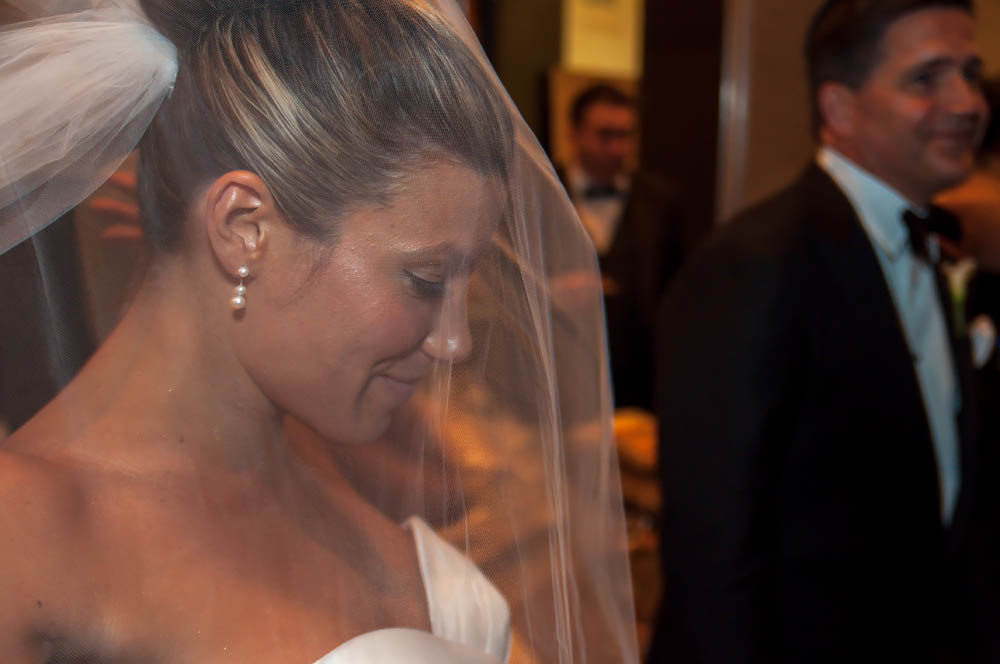 Fine art documentary wedding commission photography in NYC, blushing behind the vail, Steve Giovinco