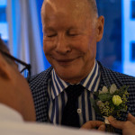 Fine art wedding documentary photography pinning flower in NYC, Steve Giovinco