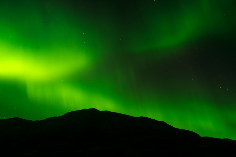 Photographing Greenland’s Photographing Greenland’s Primordial Night Landscape Northern Lights, with Mountain Silhouette in Igaliku: Lecture at Yale Club of New York