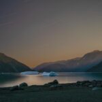 Shadow and Light: New Night Landscape Photographs of Greenland By Steve Giovinco. Yellow Sky Over the Fjord