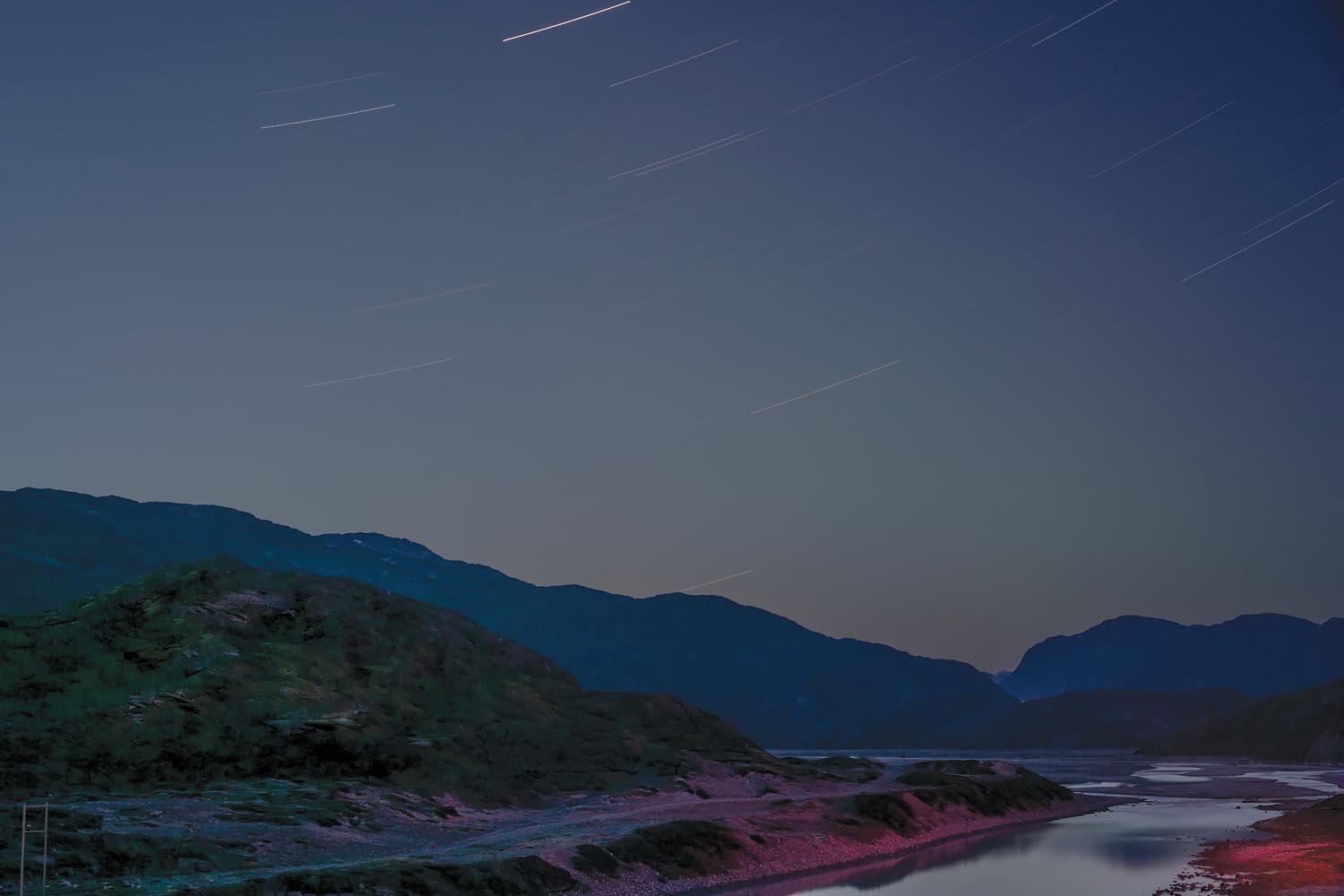 Shadow and Light: New Night Landscape Photographs of Greenland By Steve Giovinco. Red and Green Glacial River
