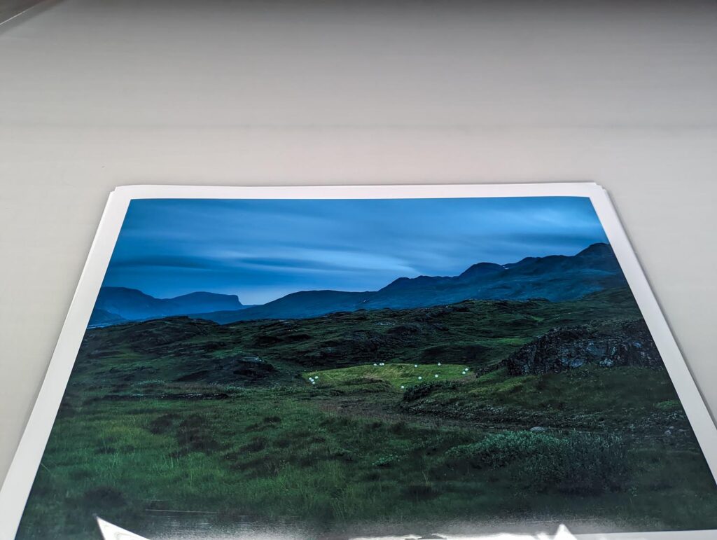 Arctic Edge, Photography Exhibition at Scandinavia House NYC, Night Landscape Photos of Greenland, By Steve Giovinco Print on Table, Farm at Night in Valley